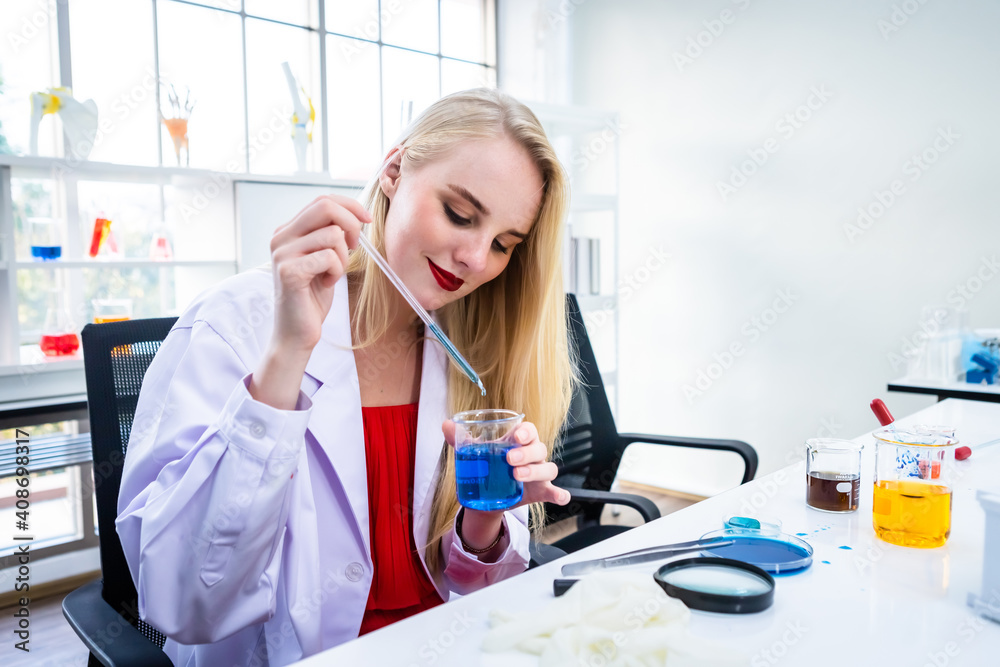 portrait of a female researcher carrying out research in a chemistry lab scientist holding test tube with sample in Laboratory analysis background portrait of a female researcher carrying out research in a chemistry lab scientist holding test tube with sample in Laboratory analysis background