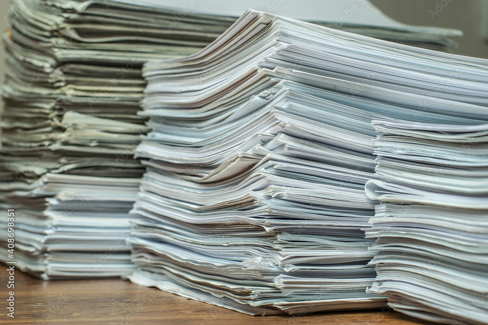 bundles bales of paper documents. stacks packs pile on the desk in the office bundles bales of paper documents. stacks packs pile on the desk in the office