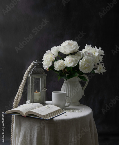 still life with a book and flowers