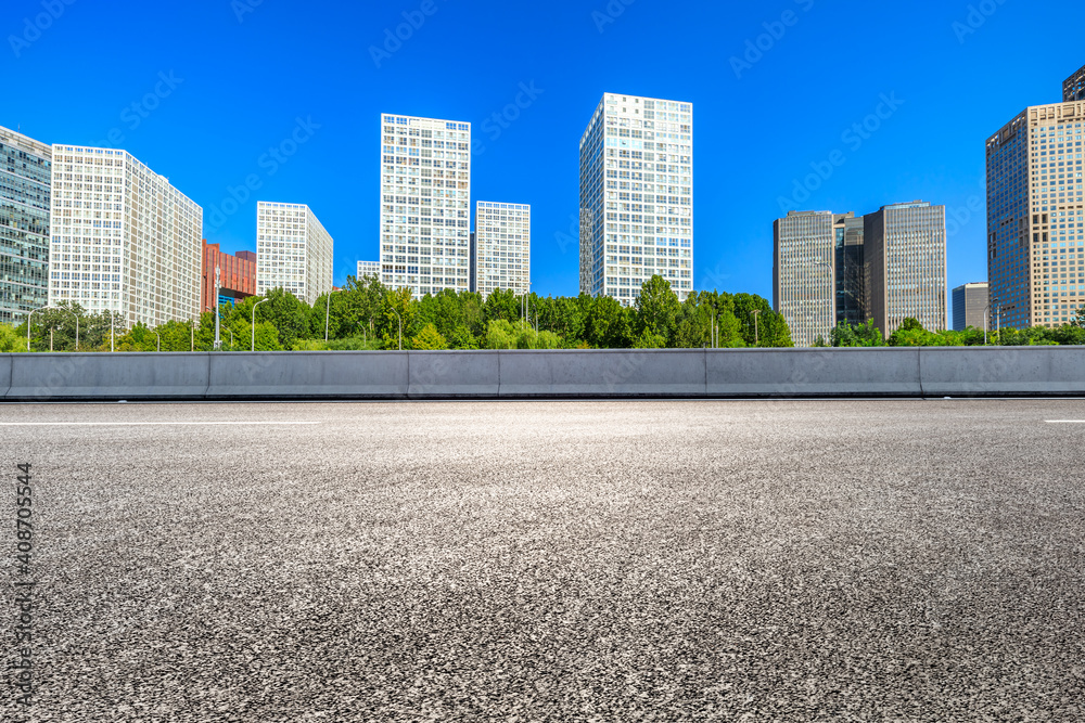Asphalt road and modern city commercial buildings in Beijing,China. Asphalt road and modern city commercial buildings in Beijing,China.