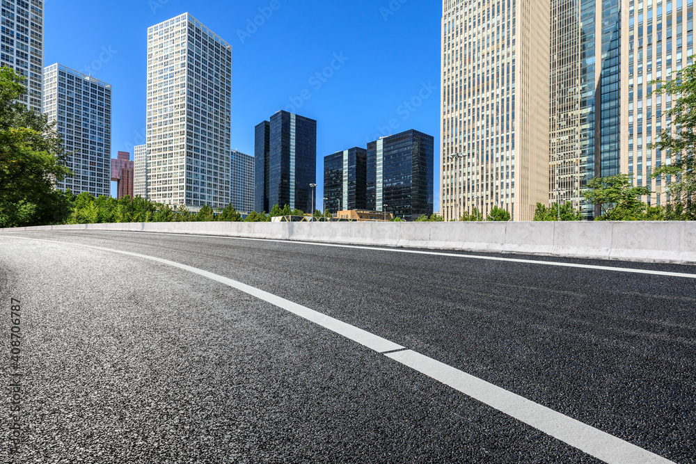 Asphalt road and modern city commercial buildings in Beijing,China. Asphalt road and modern city commercial buildings in Beijing,China.