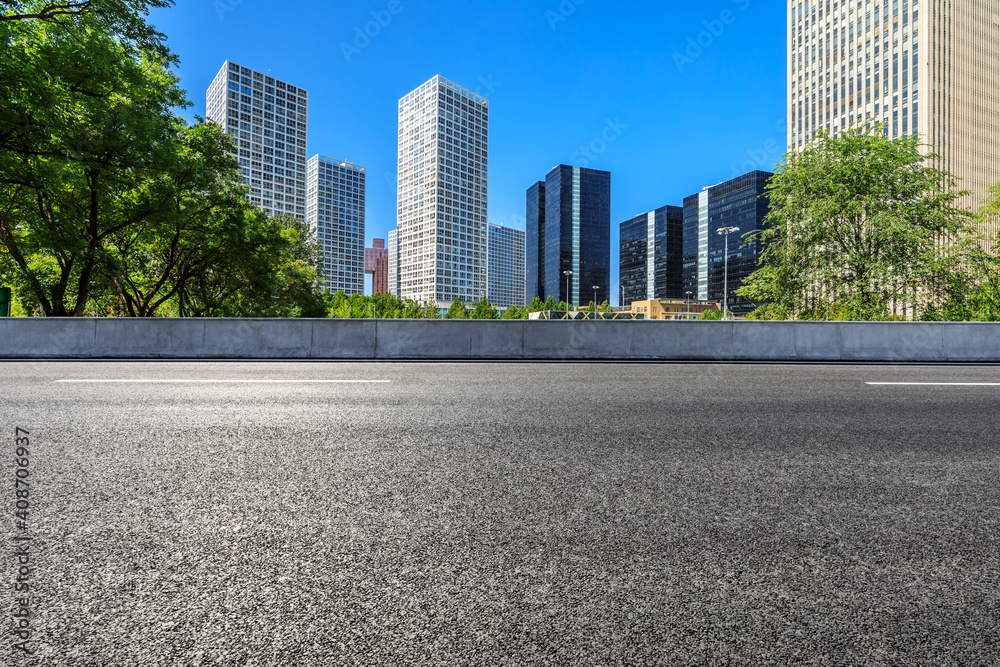 Asphalt road and modern city commercial buildings in Beijing,China. Asphalt road and modern city commercial buildings in Beijing,China.