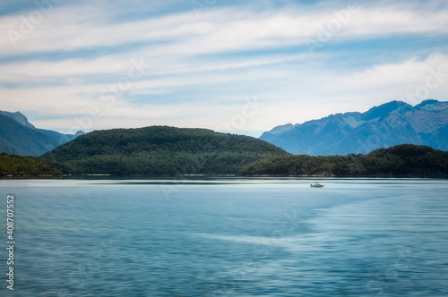 Close up on a motorboat on a beautiful afternoon on the lake at Te Anau in Fiordland National Park, New Zealand, South Island.
