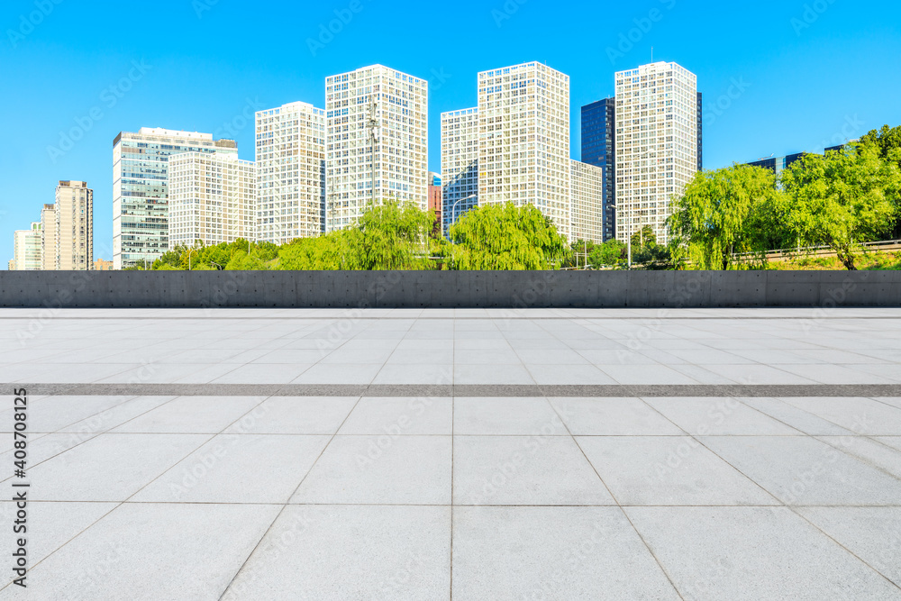 Empty square floor and modern city commercial buildings in Beijing,China. Empty square floor and modern city commercial buildings in Beijing,China.