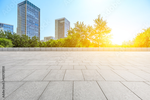 Empty square floor and modern city commercial buildings in Beijing,China. © ABCDstock