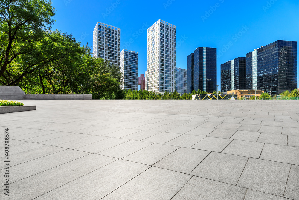 Empty square floor and modern city commercial buildings in Beijing,China. Empty square floor and modern city commercial buildings in Beijing,China.