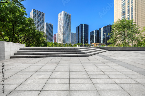 Empty square floor and modern city commercial buildings in Beijing,China.