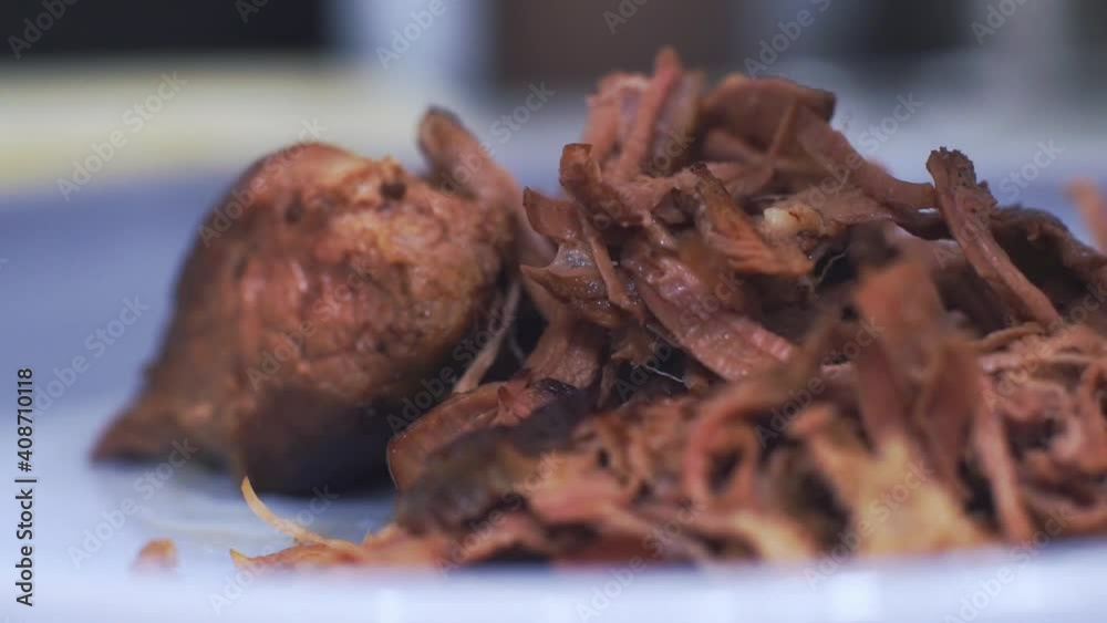 Separating the taco beef chunks into fibers Separating the taco beef chunks into fibers