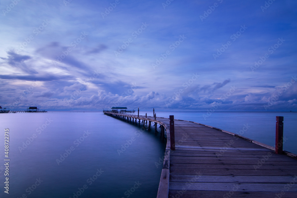 pier at dusk with cloud