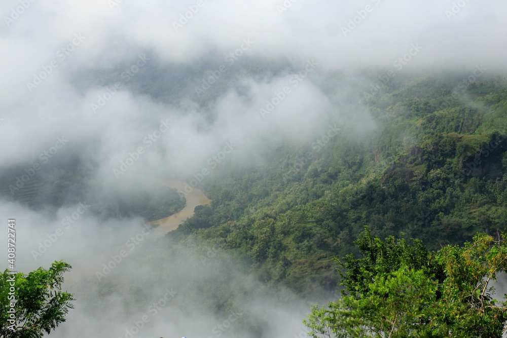 View of green and misty nature in Mangunan, Dlingo, Bantul, Yogyakarta.