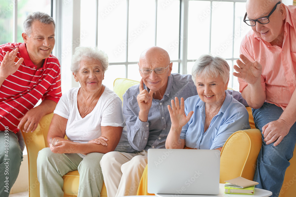 Group of senior people video chatting at home