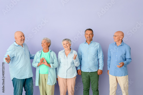 Senior people on color back...