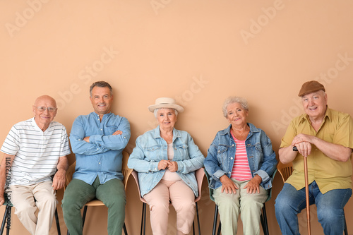 Senior people sitting on ch...