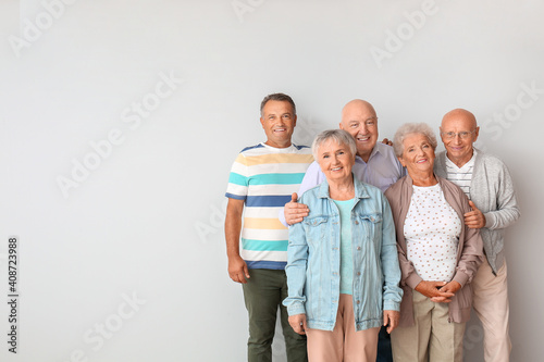 Senior people near light wa...