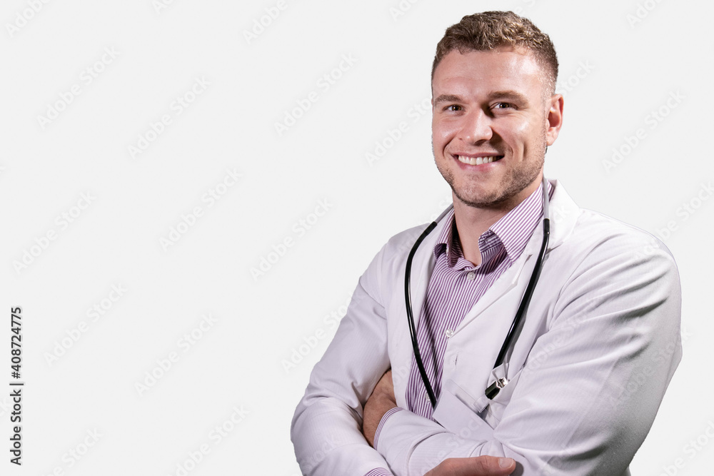Portrait of handsome male doctor, smiling and looking at camera Portrait of handsome male doctor, smiling and looking at camera