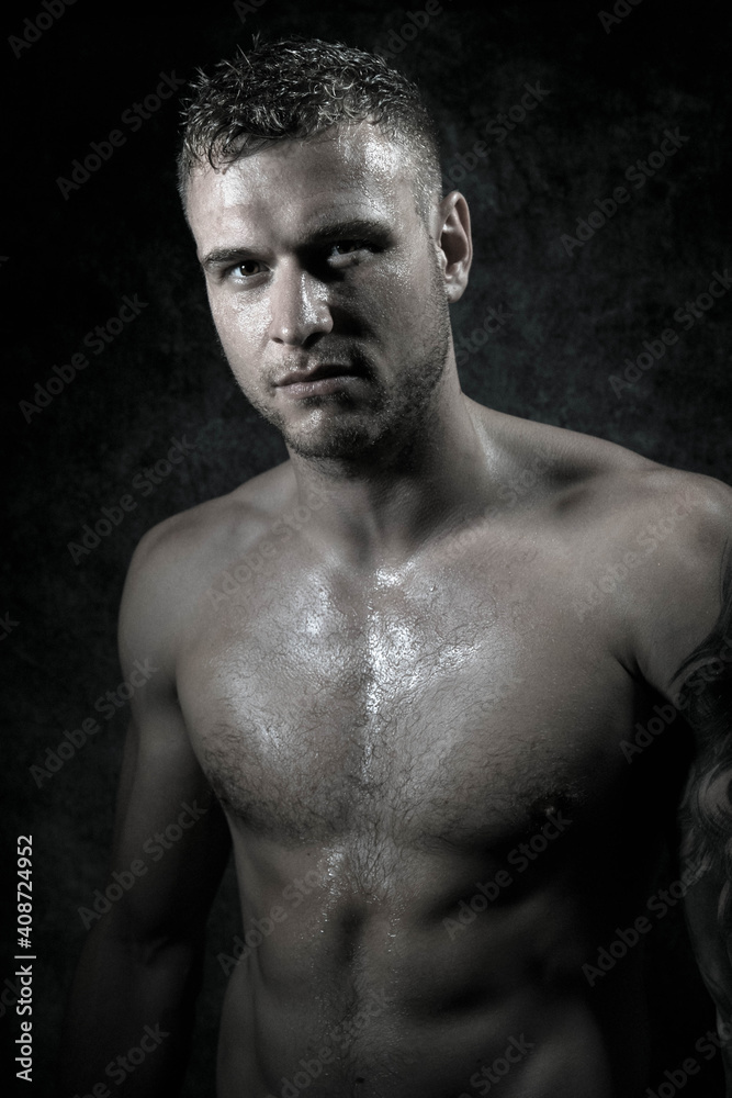 Portrait of young attractive shirtless muscular male boxer with defined abs Portrait of young attractive shirtless muscular male boxer with defined abs