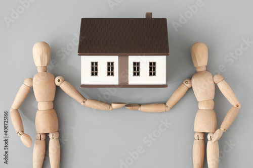 Wooden mannequins and house...