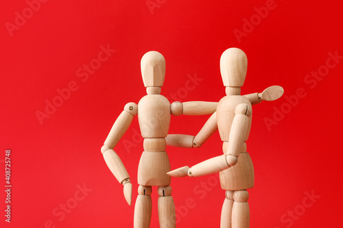 Wooden mannequins on color ...