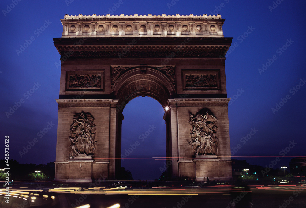Triumphal arch in a city, Arc De Triomphe, Paris, Ile-de-France, France Triumphal arch in a city, Arc De Triomphe, Paris, Ile-de-France, France
