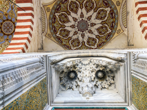 Muqarnas, which is a type of geometric decoration seen in architectural structures in Islamic art. Mystical meaning of unity and balance, owl pattern.