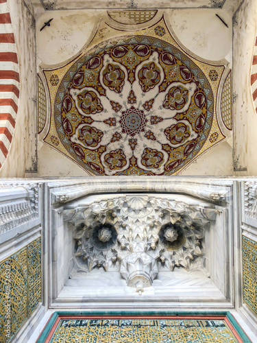 Muqarnas, which is a type of geometric decoration seen in architectural structures in Islamic art. Mystical meaning of unity and balance, owl pattern.