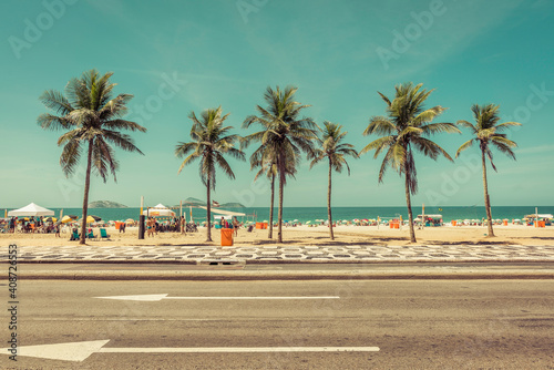 Fototapeta Naklejka Na Ścianę i Meble -  Sunny day with Palms on Ipanema Beach in Rio De Janeiro, Brazil. Vintage colors