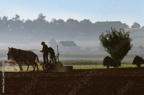 Men using horse drawn plow on Amish Farm, Lancaster, Lancaster County, Pennsylvania, USA photo