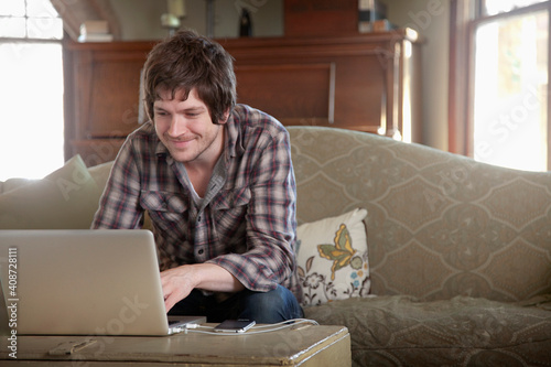 A man working from home using a laptop.