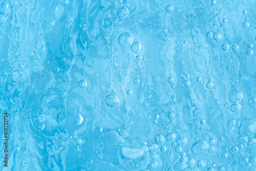 blue transparent clean drinking water abstract background. water surface with air bubbles background © Ilja