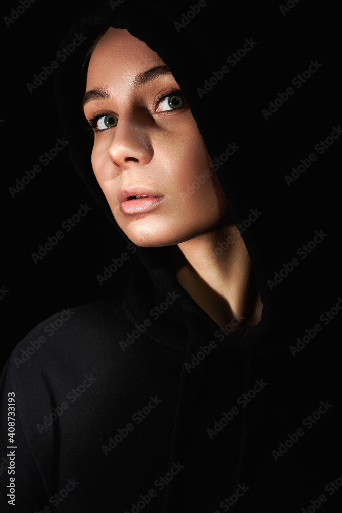 beautiful young woman in dark, weared Hoodie beautiful young woman in dark, weared Hoodie