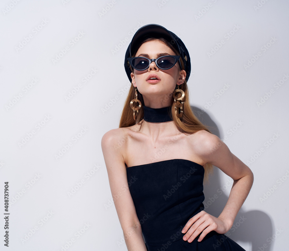 Woman in black dress dark glasses studio luxury light background Woman in black dress dark glasses studio luxury light background