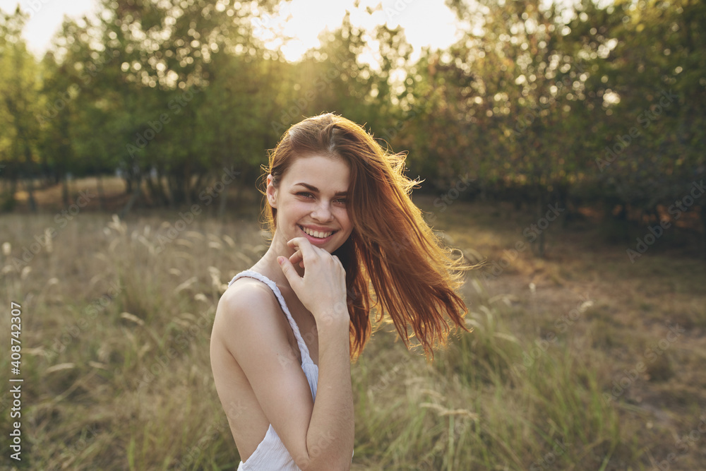 happy traveler in a field among tall trees and dry grass model vacation happy traveler in a field among tall trees and dry grass model vacation