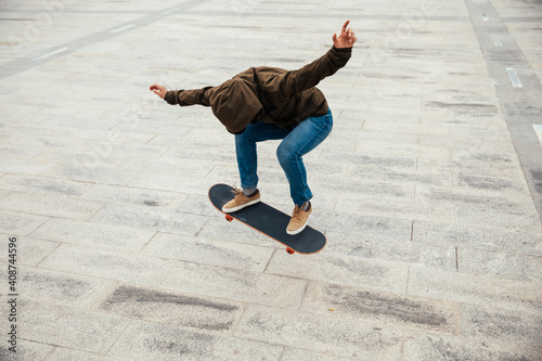 Asian woman skateboarder skateboarding in modern city