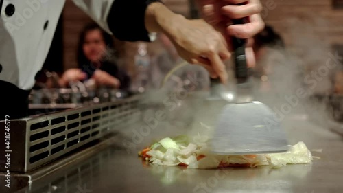 Fresh cooking .Teppanyaki Japanese Food of Japanese chef cooking of meat with vegetable grill, In the traditional Japanese food of Hibachi teppanyaki style.