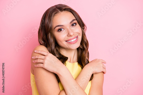 Portrait of adorable person cuddle shoulder beaming smile look camera isolated on pink color background