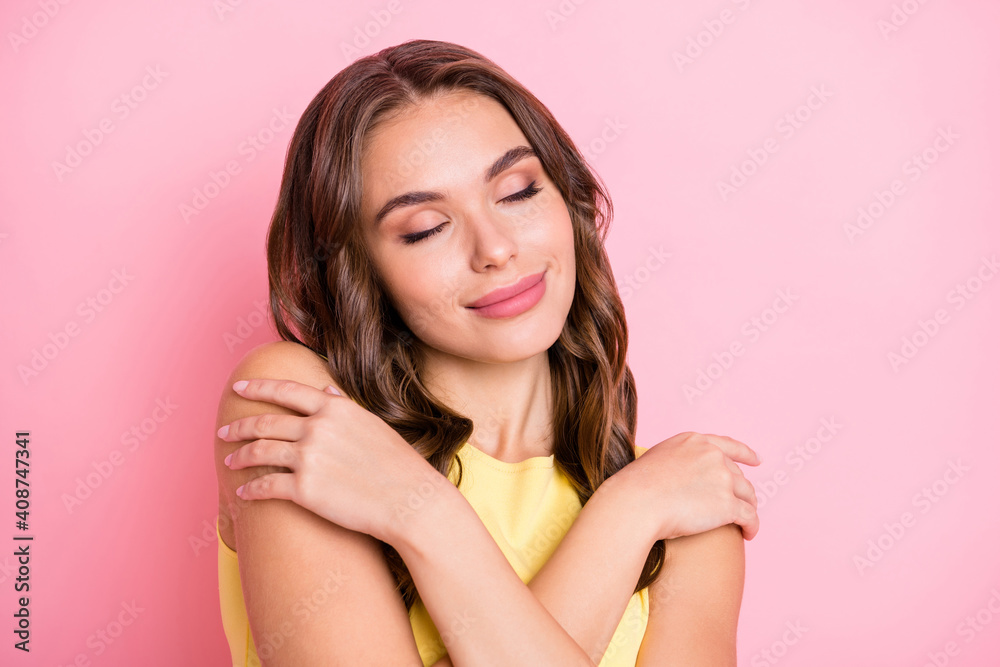 Portrait of pretty young girl closed eyes embrace shoulder imagination isolated on pink color background Portrait of pretty young girl closed eyes embrace shoulder imagination isolated on pink color background