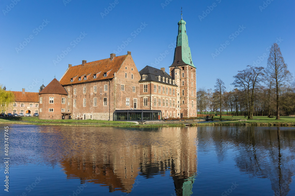 Castle Raesfeld with reflection in the water in Germany Castle Raesfeld with reflection in the water in Germany