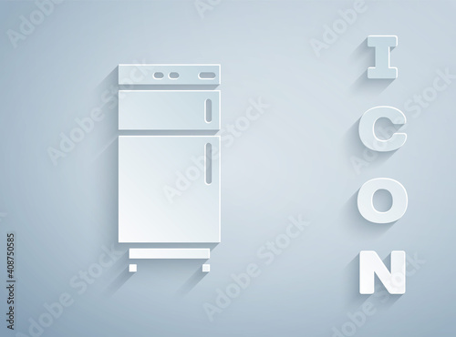 Paper cut Refrigerator icon isolated on grey background. Fridge freezer refrigerator. Household tech and appliances. Paper art style. Vector.