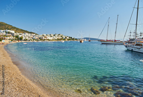 View of Bodrum Beach  Aegean sea  traditional white houses  flowers  marina  sailing boats