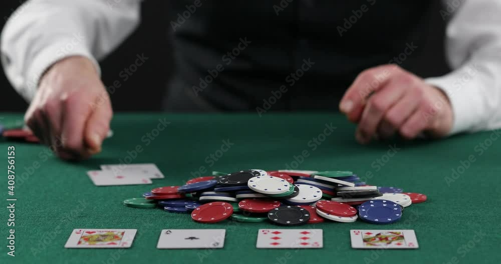 Poker player pulling in a pile of chips, large win, jackpot, successful game. Fortune, luck, gambling . Successful player stacking his chips on the poker Poker player pulling in a pile of chips, large win, jackpot, successful game. Fortune, luck, gambling . Successful player stacking his chips on the poker