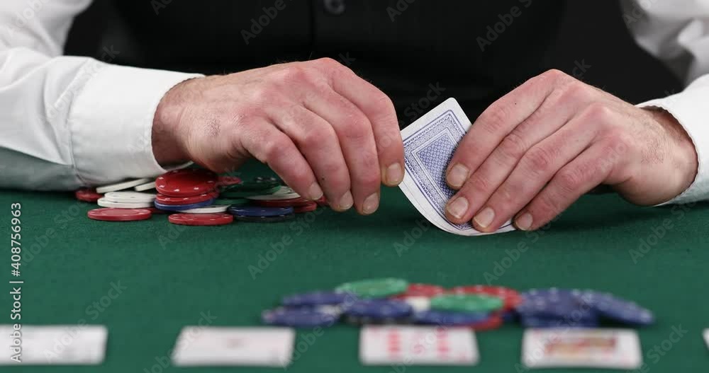 poker player betting all casino chips , poker player looks at the card and bet poker player betting all casino chips , poker player looks at the card and bet