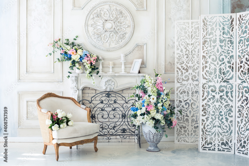 Bright luxury white and blue colored interior living room with flowers in  vases. the walls are decorated with baroque ornaments Photos | Adobe Stock