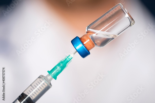 Close up of hands of doctor preparing for vaccination