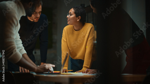 Diverse Multiethnic Team are Having a Conversation in a Meeting Room Behind Glass Walls in a Creative Office. Colleagues Lean On a Conference Table and Discuss Business, App User Interface and Design.