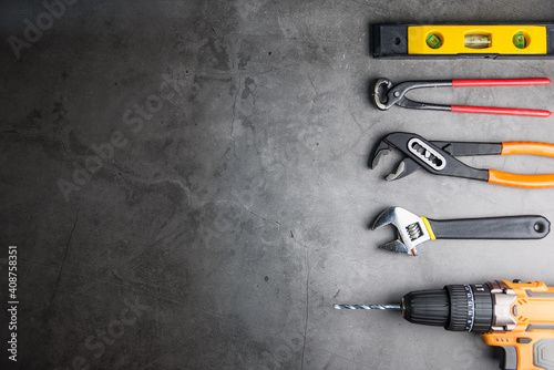 Construction tools on Gray-black cement floor background with copy space.Home Repair concept, Repair maintenance concept, Renovation concept.