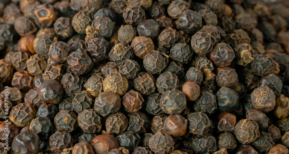 Black pepper grains as background close up. Black pepper grains as background close up.