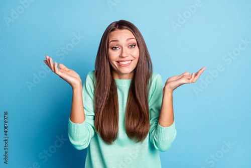 Bild auf Leinwand Portrait of lovely cute hesitant cheerful brown-haired girl shrugging shoulders