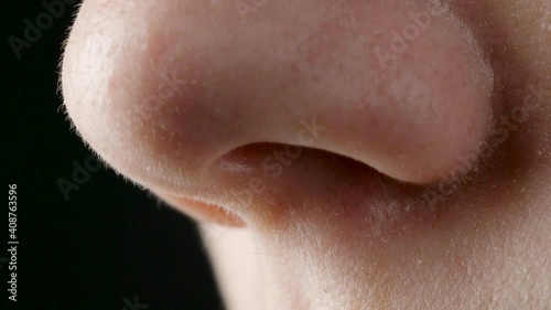 Close-up video of female breathing nose