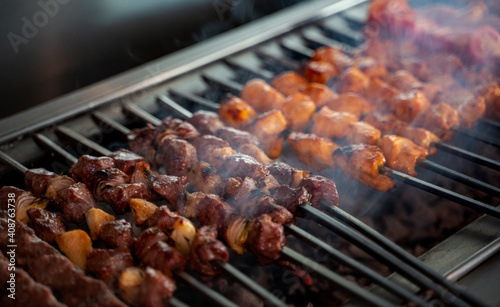 Arabic traditional food Shish taouk and lamb brochette on the grill. traditional food. photo