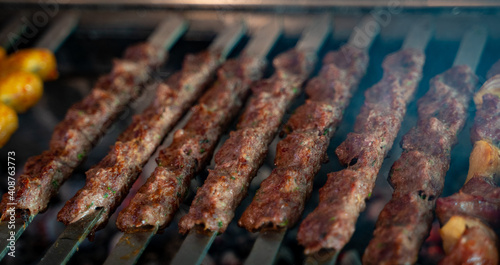 Fotografi Arabic traditional food kufta on the grill. traditional food.